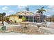 Charming backyard patio with stone pathway and seating at 5780 Elton Rd, Venice, FL 34293