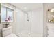 Clean bathroom with a walk-in shower and pebble floor at 5780 Elton Rd, Venice, FL 34293