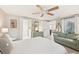 Bright bedroom with comfy sitting area and ensuite bathroom access at 5780 Elton Rd, Venice, FL 34293