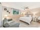 Cozy bedroom with light wood walls and a ceiling fan at 5780 Elton Rd, Venice, FL 34293