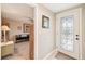 Light and airy entryway with a glass-paned door and view of living area at 5780 Elton Rd, Venice, FL 34293