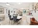 Bright kitchen featuring a white table and gray chairs at 5780 Elton Rd, Venice, FL 34293