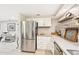 Modern kitchen with stainless steel refrigerator and gray counters at 5780 Elton Rd, Venice, FL 34293