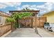 Wooden pergola with gravel ground and plants at 5780 Elton Rd, Venice, FL 34293