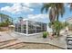 Large screened patio area with brick steps at 5780 Elton Rd, Venice, FL 34293