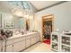 Bathroom with double vanity and large mirror at 6009 County Line Rd, Spring Hill, FL 34606