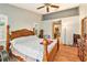 Main bedroom with king-size bed and ceiling fan at 6009 County Line Rd, Spring Hill, FL 34606