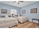 Serene bedroom with two queen beds and wood floors at 6224 Vista Verde W Dr, St Petersburg, FL 33707