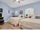 Comfortable bedroom with two queen beds and wood floors at 6224 Vista Verde W Dr, St Petersburg, FL 33707