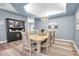 Elegant dining room featuring a large table and statement chandelier at 6224 Vista Verde W Dr, St Petersburg, FL 33707