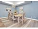 Bright dining room with a chandelier and hardwood floors at 6224 Vista Verde W Dr, St Petersburg, FL 33707