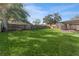 Spacious backyard with fenced perimeter and grassy area at 6512 2Nd Ave Ne, Bradenton, FL 34208