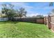 Large backyard with grassy lawn at 6512 2Nd Ave Ne, Bradenton, FL 34208