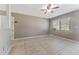 Spacious living area with tile floors and ceiling fan at 6512 2Nd Ave Ne, Bradenton, FL 34208