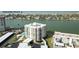 Condo building near Clearwater Beach, showing pool and parking at 750 Island Way # 401, Clearwater Beach, FL 33767