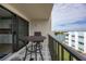 Private balcony overlooking water with table and chairs at 750 Island Way # 401, Clearwater Beach, FL 33767