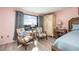 Main bedroom with seating area and large window with water view at 750 Island Way # 401, Clearwater Beach, FL 33767