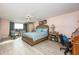 Spacious bedroom with a large window and ensuite bathroom at 750 Island Way # 401, Clearwater Beach, FL 33767