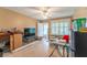 Living room undergoing renovation with exposed walls and a TV at 809 Mandalay Ave, Clearwater Beach, FL 33767