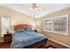 Bedroom with king-size bed and wood flooring at 9923 119Th Way, Seminole, FL 33772