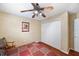 Bright bedroom with double doors and ceiling fan at 9923 119Th Way, Seminole, FL 33772