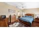 Spacious Primary bedroom with a king-size bed and ensuite bathroom at 9923 119Th Way, Seminole, FL 33772