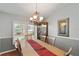 Bright dining room with table, chairs, and plantation shutters at 9923 119Th Way, Seminole, FL 33772