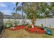 Landscaped garden with decorative plants and stone Buddha statue at 9923 119Th Way, Seminole, FL 33772