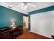 Serene home office with teal walls and double closet at 9923 119Th Way, Seminole, FL 33772