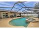 Relaxing screened-in pool with a fountain and spacious deck at 9923 119Th Way, Seminole, FL 33772