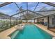 Inviting screened pool area with spa and fountain; perfect for relaxation at 9923 119Th Way, Seminole, FL 33772