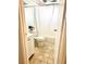 Clean bathroom with a white vanity, toilet, and bathtub at 102 Cambridge Trl # 229, Sun City Center, FL 33573