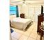 Bedroom with sliding doors to exterior and ceiling fan at 102 Cambridge Trl # 229, Sun City Center, FL 33573