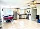 Open concept kitchen and dining area with ample counter space at 102 Cambridge Trl # 229, Sun City Center, FL 33573