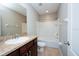 Clean bathroom with tub, shower, toilet and vanity at 10415 Butterfly Wing Ct, Riverview, FL 33578