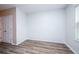 Bright bedroom with wood-look flooring and closet at 10415 Butterfly Wing Ct, Riverview, FL 33578