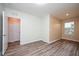 Bedroom with wood-look floors and double door closet at 10415 Butterfly Wing Ct, Riverview, FL 33578