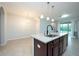 Modern kitchen with stainless steel appliances and granite countertops at 10415 Butterfly Wing Ct, Riverview, FL 33578