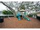 Community playground with playset and seesaw at 10415 Butterfly Wing Ct, Riverview, FL 33578