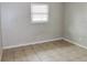 Simple bedroom with neutral walls and tile floors at 10591 116Th Ter, Largo, FL 33773