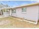 Exterior view of a single-story house with a landscaped yard at 10591 116Th Ter, Largo, FL 33773