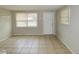 Living room with tile floors, neutral walls and windows with blinds at 10591 116Th Ter, Largo, FL 33773