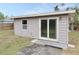 Exterior view of a detached storage shed with sliding glass doors at 10591 116Th Ter, Largo, FL 33773