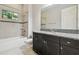 Bathroom boasts granite countertop and tiled shower/tub at 10825 Charmwood Dr, Riverview, FL 33569