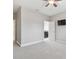 Bright bedroom with ceiling fan and ensuite bathroom access at 10825 Charmwood Dr, Riverview, FL 33569