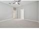 Well-lit bedroom with carpet and access to other rooms at 10825 Charmwood Dr, Riverview, FL 33569