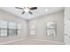 Spacious bedroom with ceiling fan and carpet at 10825 Charmwood Dr, Riverview, FL 33569