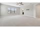 Large bedroom featuring a window and carpet at 10825 Charmwood Dr, Riverview, FL 33569