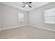 Bright bedroom featuring neutral walls, carpet, and window blinds at 10825 Charmwood Dr, Riverview, FL 33569