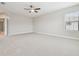 Spacious bedroom with large window and carpet at 10825 Charmwood Dr, Riverview, FL 33569